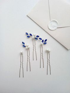 Introducing our exquisite elegant bridal hair pin set, a collection of 5 stunning pearl-adorned hair pins designed to elevate your wedding day or special occasion ensemble. Crafted from top-tier materials including crystal rhinestones, lustrous pearl beads, and silver-plated jewelry wire, these high-quality hair pins exude sophistication and timeless allure. Each blue hair pin is meticulously assembled to enhance your hairstyle with grace and elegance, ensuring a radiant and refined look. Custom Something Blue Hair Pin, Silver Blue Hair, Blue Hair Pins, Navy Blue Hair, Bridal Hair Pins Pearl, Hair Pins Bridal, Blue Hair Accessories, Bridesmaid Hair Pins, Accessories Pearl