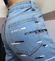 the back of someone's jeans with writing on them