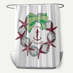 a shower curtain with an anchor, starfish and bow on the bottom that says seas greeting