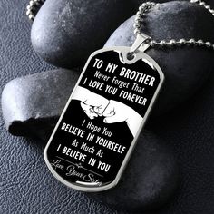 a dog tag with the words to my son i love you forever on it