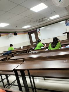 some students are sitting at desks in a classroom