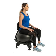 a woman sitting on top of an exercise ball