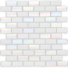 a white brick wall that is made out of small squares and has iridescents