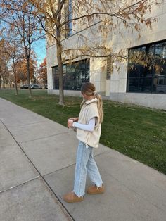 fall outfit, denim, light wash, uggs, sherpa, vest outfit, fall 2024, back to school, white top, basic outfit, style, women’s fashion, balayage, mug, fall season, board ideas Aritzia Fleece Vest Outfit, Ll Bean Slippers Outfit, White Winter Vest Outfits, Cloudy Fall Day Outfit, Ugg Casual Outfit, White Denim Outfit Winter, Well Put Together Outfits, March Church Outfits, Stone Outfit Ideas