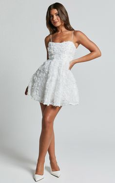 Get ready to turn heads at your next party night with the Alvia Mini Dress. This flirty and playful dress is perfect for dancing the night away. The 3D flower detailing on the full skirt adds a touch of whimsy, while the white color brings an air of elegance. Made from high-quality polyester, this A-line dress will keep you feeling comfortable all night long. With its sleeveless design and straight silhouette, it's sure to accentuate your figure in all the right places. Whether you're hitting up Red Sequin Dress, Basic Black Dress, Spring Maxi Dress, Bachelorette Dress, Neon Outfits, Navy Bridesmaid Dresses, Full Skirt Dress, Long Sleeve Knit Dress, Winter Dresses