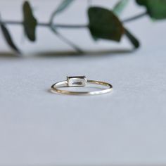 >Eye-catching baguette accents this silver ring. >925 sterling silver hallmarked >Sterling silver is an almost pure metal made from 92.5% Silver. >Approx. 1mm band width; 3mm x 5mm cubic zirconia. Rose Gold Vermeil: https://www.etsy.com/listing/616359482/14k-rose-gold-vermeil-ring-baguette-ring?ref=shop_home_active_13 FREE SHIPPING USA- All of our jewelry will arrive in custom packaging ready for gift giving. CARE: To prolong the color and shine of your jewelry, avoid contact with pe Hallmarked Minimalist Sterling Silver Stackable Rings, Minimalist Hallmarked Stackable Rings In Sterling Silver, Minimalist Hallmarked Stackable Sterling Silver Rings, Silver Stackable Baguette Cut Rings As Gift, Silver Emerald Cut Stackable Rings Fine Jewelry, Everyday Silver Jewelry With Emerald Cut, Everyday Delicate Silver Rings, Silver Sterling Baguette Cut Ring, Minimalist Silver Baguette Cut Jewelry