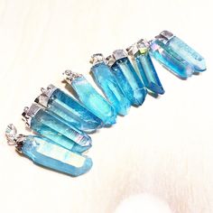 "Listing is for one blue Aura crystal quartz Point Pendant Pendant Size: approx. 30-55mm(L) x 8-15mm(W) QTY: 1 piece STOCK PHOTOS-- Pendants will vary slightly as to the shape and size of crystal Quartz, making each ring unique.  Quartz is a power stone. It has been called the \"Universal Crystal\" because of its many uses. It enhances energy by absorbing, storing, amplifying, balancing, focusing and transmitting." Blue Mineral Crystal Necklace For Gift, Blue Crystal Pendant Necklaces, Blue Mineral Crystal For Healing, Blue Aura, Blue Angel, Aura Crystals, Power Stone, Angel Aura Quartz, Photo Pendant