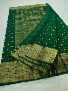 This Pure Chanderi Katan Silk Original in dark green with Single naal thousand buttis and a grand border and Aanchal is an absolute masterpiece. This is an authentic saree handwoven in the same weaving technique and style with which Anushka's beautiful saree was made. The Material, design, and quality are exactly the same as the one that Anushka wore to one of the most prestigious award ceremonies. The grandeur of this Saree makes it a perfect pick for ANY occasion. To see our entire Chanderi co Festive Dark Green Dupatta For Wedding, Festive Dark Green Wedding Dupatta, Festive Wedding Dark Green Dupatta, Dark Green Dupatta With Zari Work, Dark Green Traditional Wear With Cutdana For Diwali, Dark Green Dupatta For Wedding On Eid, Dark Green Traditional Wear With Dupatta For Eid, Dark Green Dupatta For Wedding And Eid, Dark Green Dupatta For Wedding And Festivals