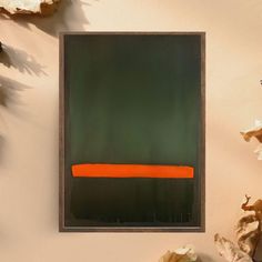 an orange and green painting on a wall