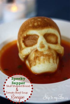 a skull shaped waffle is in a bowl of tomato soup with the words spooky stuff on it