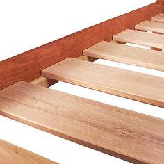 a bed frame with wooden slats on it