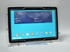 an image of a tablet on display in a clear plastic case with the screen open