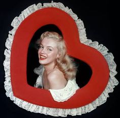 marilyn monroe on instagrams about her love for valentine's day, with the caption if i loved i could no more hide the fact than change the color of my eyes happy valentine's day