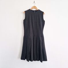 "Long and preppy vintage pinafore dress circa 1970s/80s, perfect for layering with a long-sleeve or jumper in the winter. * Charcoal, navy and chocolate brown fibres * Darted bodice * Pleated skirt * Bodice is lined * Handmade  * Metal talon zip SIZE * Bust: 37\"  * Waist: 34\"  * Hips: 35\"  * Length: 41\"   BRAND Unbranded, handmade. CONDITION Excellent condition.   Any questions? Ask away! :) FREE UK DELIVERY More vintage dresses at https://www.etsy.com/uk/shop/ragandmagpie?section_id=2449509 Vintage A-line Dress For Work, Retro A-line Vintage Dress For Work, Preppy Fitted Knee-length Dresses, Classic Knee-length Vintage Dress For Work, Preppy Fitted Dresses For Work, Classic A-line Vintage Dress Lined, Preppy Fitted Sleeveless Dress, Vintage Sleeveless Pinafore Dress For Fall, Classic Cotton Dress With Pleated Hem