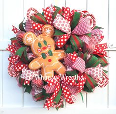 a christmas wreath with a gingerbread man on it