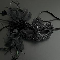 Masquerade mask in black. Simplistic for woman with a black floral- destined to pop out at any event, wedding etc This masquerade mask is great for any occasion. Cheap Black Masquerade Mask For Carnival, Black Masquerade Mask Ball, Cheap Masquerade Mask For Halloween Costume, Luxury Black Masquerade Mask For Carnival, Luxury Black Masquerade Mask For Halloween, Luxury Black Masquerade Mask For Costume, Luxury Black Masks And Prosthetics For Costume Party, Luxury Full Face Masquerade Mask For Party, Black Masquerade Dress Lightinthebox