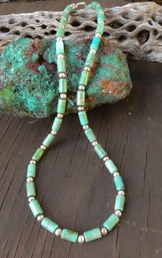 This Navajo turquoise necklace is a classic Native American accessory that you've been searching for. It is handcrafted with beautiful Turquoise beads feature subtle variations of green/blue. This is that boho-chic accessory that will enhance your casual or dressy wardrobe. Measures: 17 1/4" toggle closure Beads vary from 1/4" Weight:15 grams Thank you for shopping with Highway 66 Treasures! 😊 Please note: Most items are vintage. I clean and polish every item I ship due to concerns about germs etc... If you want your purchase left "as is" let me know before shipment. Keep in mind, that means fingerprints etc. In my opinion it's better to polish and if you want the item to tarnish, just leave it on your windowsill for a couple of weeks without wearing. Cheap Turquoise Long Beaded Necklace, Hand-strung Green Beaded Necklaces Southwestern Style, Southwestern Green Turquoise Necklace, Southwestern Single Strand Green Turquoise Necklace, Southwestern Green Single Strand Turquoise Necklace, Adjustable Southwestern Green Turquoise Necklace, Southwestern Green Turquoise Necklace With Gemstone Beads, Real Turquoise Jewelry, Boho Chic Accessories