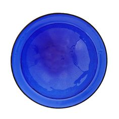 a blue plate with black rim is shown on a white background and it appears to be empty