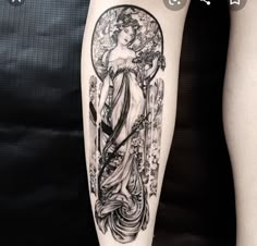 a woman's leg with an art nouveau tattoo design on the left arm and shoulder