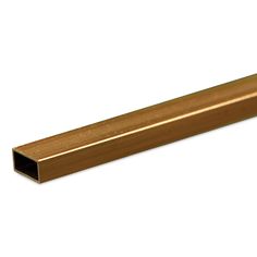 a gold colored tube on a white background