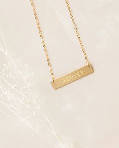 The daintiness of our personalized name necklace adds the perfect touch to any outfit! The simplicity of this custom necklace allows you to mix and match with a variety of styles to create an elegant look. Beautifully engraved, this customized piece makes the perfect gift for Valentine’s Day, Mother’s Day, Christmas and all special occasions and milestones!Material: 14k gold filled, anti-tarnish material (will not turn blue or green and will not stain skin)Bar Size: 1.25” W x 0.25” HChain Length Skull Jewelry Women, Skin Bar, Tiffany And Co Necklace, Gift For Valentine, Turn Blue, Bar Necklace Personalized, Silver Bar Necklace, Gold Bar Necklace, White Gold Necklaces