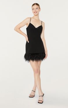 Show off your flattering silhouette in our Cora Dress. Featuring a black fit and flare silhouette with a v-neckline and bow detail, and a mini skirt with a feather hem. Be ready to make a statement in this stunning piece. Fit Details V necklineLinedFit and flare silhouetteMini lengthSleeveless67% Polyester 27% Rayon 6% SpandexDry Clean Only Made in USA Length: 23.5in/59.69cm, from strap seamMeasurements from size 4 Fit Details, Black Fits, Bow Detail, Price Match, Dresses Xs, A Black, Fit And Flare, Mini Skirt, Mini Skirts