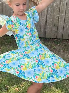 Green and Blue Floral twirl dress. Flutter sleeves, cross back, huge twirl, modest cut perfect for any occasion Casual Flutter Sleeve Twirl Dress With Ruffles, Spring Twirl Dress With Ruffles And Flowy Fit, Spring Flowy Twirl Dress With Ruffles, Casual Twirl Dress With Flutter Sleeves And Ruffles, Casual Summer Twirl Dress With Flutter Sleeves, Spring Floral Print Twirl Dress With Flutter Sleeves, Spring Twirl Dress With Floral Print And Flutter Sleeves, Spring Floral Twirl Dress With Flutter Sleeves, Fitted Ruffles Twirl Dress For Garden Party