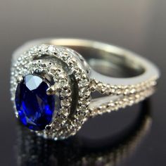 an oval shaped blue sapphire and diamond ring