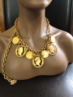 Hello and Welcome to LiamBySevanna! Prior-purchasing any listing from this shop, please Ask question/s, Request additional photos, to make sure the listed item, is the right choice for you! Per our store policy we don't accept returns Listing is for: 1980 Etruscan French Napoleon Coin charm necklace Runway Couture matte Gold French Coin & Medallion Necklace. GORGEOUS MATTE BRUSHED GOLD FRENCH COIN NECKLACE ~ CIRCA 1979 OR 1980 ~ MARKED ON ORIGINAL TAG NAPOLEON RN40383 ~ MEASURES 30" LENGTH ~ 3 NAPOLEONS PROFILE MEDALLION 1-3/4 INCH IN DIAMETER ~  4 REPUBLIQUE FRANCAISE 1904 COINS 1 INCH IN DIAMETER ~ 6 ORNAMENTS 3/4 INCH. I'm sure you know, but just incase I'm putting it out there that this is a fashion necklace the gold, the coins are NOT real solid gold or authentic coins that are used i Luxury Collectible Medallion Necklace, Formal Medallion Charm Necklace, Formal Medallion Charm Necklaces, Formal Medallion Charms Necklace, Formal Medallion Necklace With Charms, Luxury Charms Necklace, French Coins, 80’s Fashion, Knot Bracelet