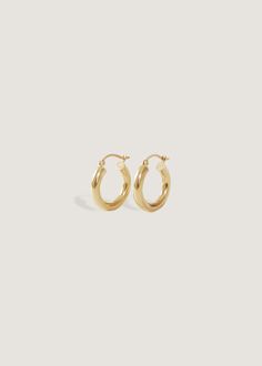 Your favorite oversized hoops. Wear them day to night, with jeans and a white tee or a power pant suit. We made them easy to put on (trust us, we've tried on every hoop!) and hollow, so they won't weigh you down.Complete the look with our Pavé Hoop Huggie Earrings. Hinged back closure. 14k solid gold—always Weight: 0.5g per earring Measurements: 3x15mm Classic 14k Gold Filled Hoop Earrings For Everyday Luxury, Classic 14k Gold Hoop Earrings For Everyday, Classic Small Hoop Earrings In 14k Gold Filled, Tarnish Resistant Hoop Earrings, Minimalist 14k Gold Hoop Earrings With Shiny Finish, Classic 14k Gold Huggie Earrings, Everyday Tarnish Resistant Hoop Earrings, Everyday Tarnish-resistant Hoop Earrings, Classic Round Hoop Earrings For Everyday