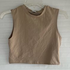 Crop Top. Never Worn. Spring Beige Crew Neck Tank Top, Casual Cropped Beige Tank Top, Casual Beige Cropped Tank Top, Basic Beige Tank Top For Spring, Summer Brown Crew Neck Tank Top, Brown Crew Neck Tank Top For Summer, Beige Sleeveless Crop Top For Everyday, Sleeveless Beige Crop Top For Everyday, Simple Cotton Summer Crop Top