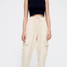 New With Tags Zara Zara Ecru Cargo Pants.Size Large Cream Tapered Leg Summer Bottoms, Beige Straight Cargo Pants For Spring, Cream Tapered Leg Bottoms For Spring, Cream Tapered Leg Summer Pants, Cream Pants With Elastic Waistband For Work, Cream Tapered Leg Pants With Elastic Waistband, Cream Workwear Pants With Elastic Waistband, Cream Wide Leg Cargo Pants For Summer, Wide-leg Cream Cargo Pants For Summer