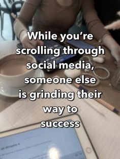 a woman sitting at a table with a tablet and cup of coffee in front of her, while the caption reads while you're scrolling through social media, someone else is grinding their way to success