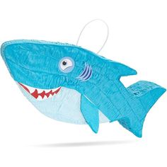 a blue shark pinata hanging from a string