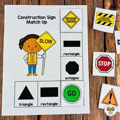 construction sign match up with matching stickers on a wooden table next to cutouts