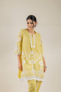 PRODUCT DETAIL: This bright and vibrant set comes laden with a beautiful cutwork embroidery. The lace detailing on the shirt and the tulip pants adds to the beauty of the outfit. *The length of the shirt can be customised. Contact us to get yours as per your preferences. SPECIFICATIONS: Color Yellow Fabric Cotton Product Code RANG18 Designer Lace Work Kurta, Designer Lace Work Sets For Spring, Designer Straight Kurta Palazzo Set With Lace Work, Designer Palazzo Set With Straight Kurta And Lace Work, Unstitched Lace Work Kurta For Spring, Spring Anarkali Set With Cutwork, Festive Palazzo Set With Cutwork And Straight Kurta, Festive Palazzo Set With Straight Kurta And Cutwork, Spring Straight Kurta With Lace Work