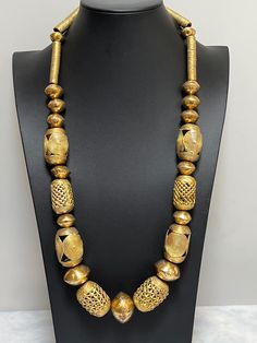 "Necklace of African handmade brass imported beads.   Bold and ethnic.  Wear it at an art opening, wedding, or just out to dinner.  Enjoy its DRAMA!  Approximately 30\"." Luxury Bohemian Beads As Statement Piece, Black African Necklace, Artisan Brass Necklaces For Festivals, Artisan Brass Necklace With Polished Beads, Artisan Brass Jewelry With Large Beads, Bohemian Gold Necklace With Polished Beads, Handmade Brass Beaded Necklace For Festivals, Bohemian Necklace With Large Beads For Ceremonial Use, Bohemian Necklace With Large Beads For Ceremonial Occasions