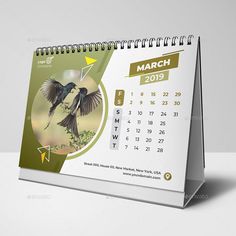 a desk calendar with a bird on it