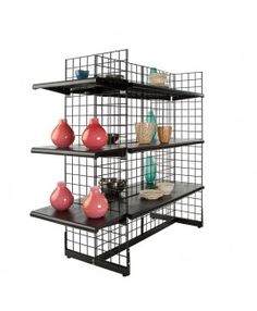 three shelves with vases and baskets on them