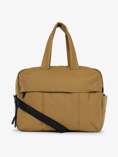 CALPAK Luka large duffle bag with detachable strap and zippered front pocket in khaki; DLL2201-KHAKI Trendy Travel Bag With Pockets For On-the-go, Nylon Travel Bag With Pockets For On-the-go, Functional Travel Bag With Adjustable Strap For Daily Use, Functional Travel Accessories With Pockets For On-the-go, Functional Nylon Weekender Bag With Pockets, Practical Luggage With Adjustable Strap For Everyday Use, Functional Everyday Shoulder Bag With Side Pockets, Functional Bags With Side Pockets For On-the-go, Modern Bags With Side Pockets