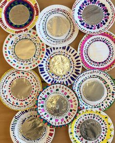 paper plates with different designs on them sitting on a table