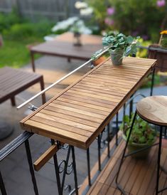 a wooden table sitting on top of a wooden deck