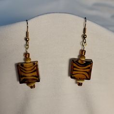 Tiger Striped Murono Glass Earrings Handmade And Designed. One Of A Kind. 2 1/4" From Top Of Earwire To Bottom Of Seed Bead. Width Of Largest Bead 1 1/4" Color Is Brown Gold And Amber. Murano Glass Beads, Tiger Stripes, Wire Crafts, Glass Earrings, Ear Wire, Seed Bead, Murano Glass, Brown Gold, Wire Jewelry