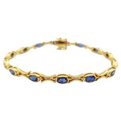 Blue Sapphire 4.19 carats Bracelet set in 18 Karat Gold Settings Width: 0.4 cm Length: 18.0 cm Total Weight: 12.98 grams "We first opened doors in 1980 when it was then situated in the vicinity of the Victory Monument; a small and modest storefront with a couple of counters. From its humble beginnings to where it stands today, our company has proven its abilities as a jeweler. Since the beginning, we have been supplying fine quality pieces to dealers, wholesalers and customers worldwide. From th Luxury Blue Gold Classic Bracelet, Luxury Blue Gold Bracelet For Formal Occasions, Classic Hallmarked Tennis Bracelet For Formal Occasions, Classic Formal Hallmarked Tennis Bracelet, Classic Blue Round Gold Bracelet, Classic Blue Gold Bracelet, Classic Gold Gemstone Bracelet For Formal Occasions, Classic Gold Bracelet With Gemstone, Blue Sapphire Bracelet