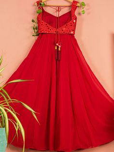 This is two-piece Red Mirror Work Anarkali set from the Anisha Shetty collection. This beautiful red georgette anarkali is paired with a red net dupatta. The red color with mirror work and a tassel tie-up at the back enhance this anarkali set. The red dupatta has the cutdana and tassel border detail.
Churidar NOT included. Mirror Work Anarkali, Red Dupatta, Georgette Anarkali, Red Mirror, Net Dupatta, Modern Dress, Mirror Work, Churidar, Bridal Outfits