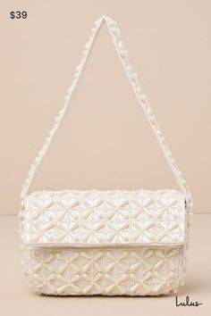 Your going-out look just isn't finished without the Lulus Luxe Perception Ivory Pearl Beaded Mini Shoulder Bag! This stunning little bag packs a big punch, thanks to an allover design of gorgeous faux pearl beads across the rectangular, flat-bottom silhouette. Fold-over top flap has a magnetic closure that opens to reveal a roomy, satin-lined interior with a single sidewall pocket. Flexible shoulder strap completes the look. Lined. Bag Measures 8" Wide, 6" Tall, And 2" Deep. Handle Has A 8. 5" D Cream Rectangular Shoulder Bag With Pearl Handle, Beige Clutch Bag With Pearl Embroidery, Cream Beaded Rectangular Shoulder Bag, Party Shoulder Bag In Cream With Pearl Embroidery, Cream Shoulder Bag With Pearl Embroidery For Party, Chic Cream Bag With Pearl Embroidery, Chic Cream Bags With Pearl Embroidery, Cream Rectangular Bag With Pearl Embroidery, Cream Rectangular Evening Bag For Summer