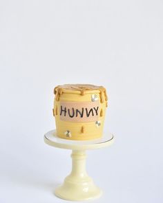 a cake that is sitting on top of a white plate with the words hummy written on it