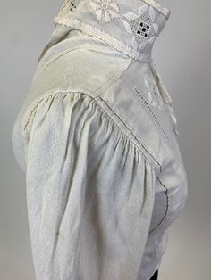 Authentic Antique Edwardian Victorian White Linen embroidered Bodice or blouse with high neckline and full sleeves. This special antique white linen blouse has delicate embroidered details of geometric shapes. The sleeves are full at the shoulder, gathering into the seam and tapers at the cuff. At one point there were buttons and loops up the back of the blouse, but the buttons have since fallen off while the loops remain intact. Once the buttons are replaced this piece will be in wearable condi White Linen Blouse, West Chester Pa, Embroidered Bodice, West Chester, Vintage Clothing Online, Vintage Fits, Embroidered Details, Linen Blouse, House Dress