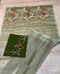 Absolutely beautiful in pastel shade ( pista green ),Tantuja muslin by muslin 120 count Jamdani saree.All over body  birds , flower and leaf motifs in Jamdani weaving. Selvedge bottle green border, fully woven palla.   Completely handcrafted item from the master weavers of Bengal. You can easily go for this light weight ,soft yet rich texture  , vibrant  coloured saree for a traditional attire for any occasion. This saree has no blouse piece. Attached blouse piece is an embroidered matching one .  Fall , pico complimentary. Muslin Jamdani Saree, Pista Green, Green Border, Jamdani Saree, Traditional Attire, Pastel Shades, Colour Board, Bottle Green, Rich Textures