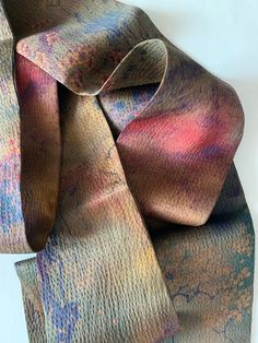 "Elegant and luxurious Gambiered Canton Silk Narrow Long Skinny Scarf/Necktie Scarf.  Double layer, double-sided: 150 cm x 6.5 cm / 59 in x 2.6 inch.  Gambiered Canton Gauze, also called \"fragrance cloud silk\", \"soft gold\" or \"mud silk\". It uses pure natural silk as its grey fabrics, and dye yam plant in Canton province as its dyestuff. The dyeing and finishing processes usually go through 16 steps of traditional manual techniques.  This fabric is light, organic, highly breathable, feels comfortable and pleasantly cool, beneficial to the skin, easy to wash and does not wrinkle. It shines very subtly, giving an impression of low-key luxury.  To care, gently hand wash in cold water and natural dry. Stored in a dry, cool and dark place. This item is specially designed custom made by a f Necktie Scarf, Neck Scarf Tying, Silk Neck Scarf, Scarf Hair, Hair Scarf, Scarf Gift, Silk Charmeuse, Neck Scarf, Natural Silk